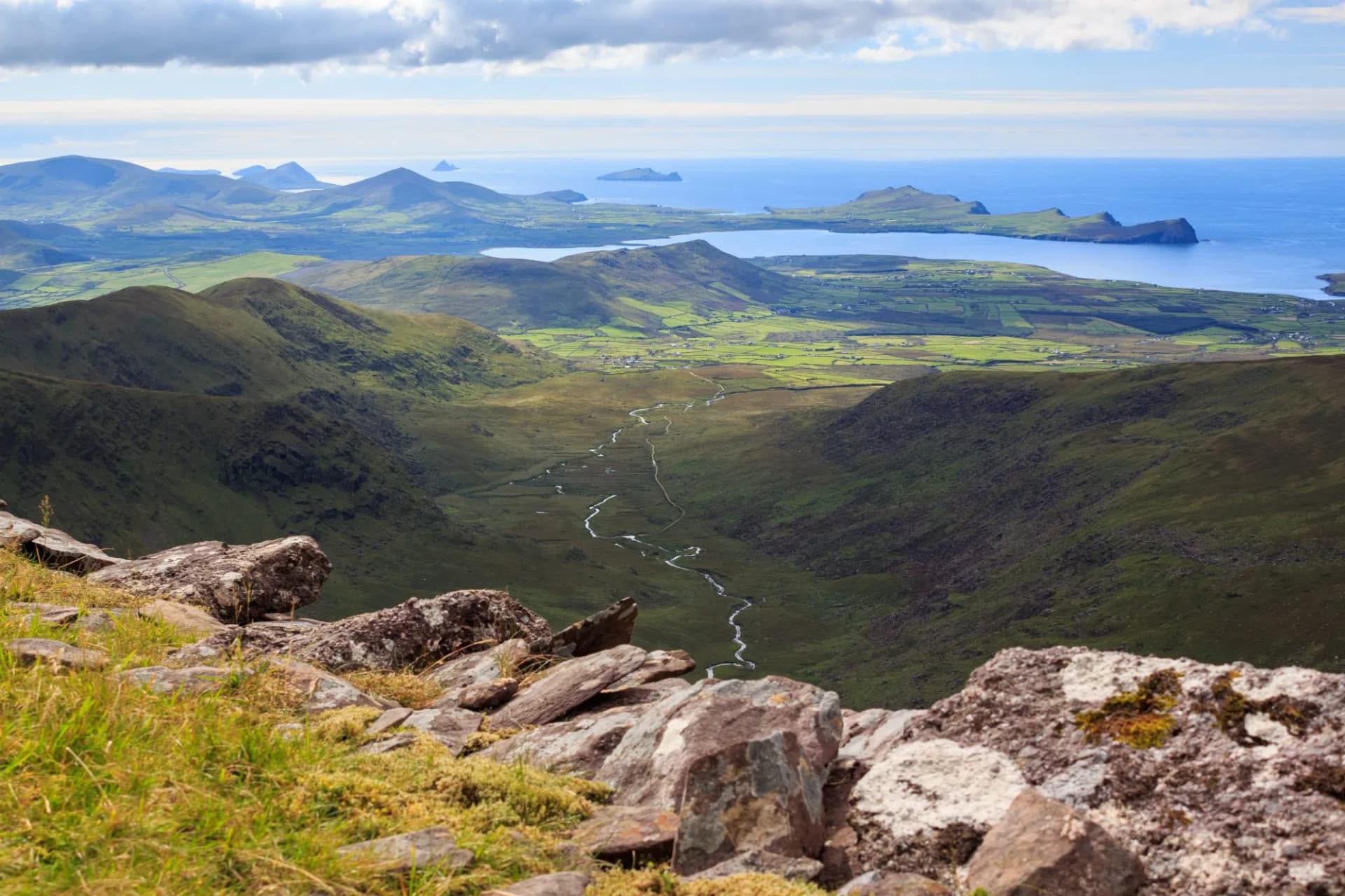 Looking West along the Feohanagh River valley towards Smerwick Harbour, Sybil Head and the Blasket Islands on the Dingle Peninsula in County Kerry, Ireland