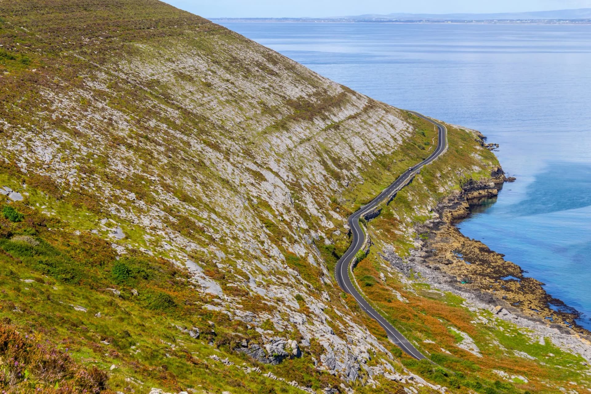 Burren way trail with Galway bay in background