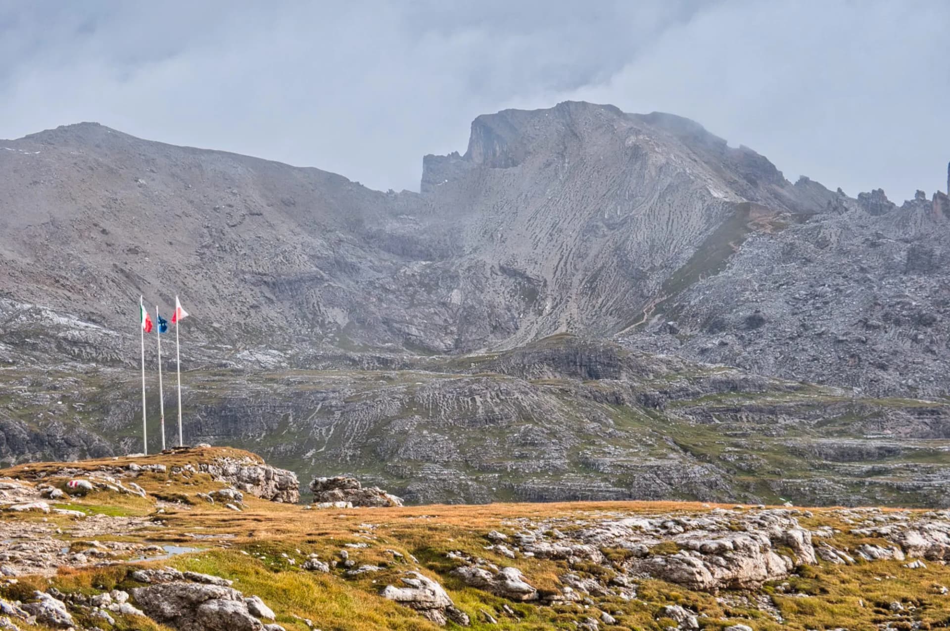 Flags at Rifugio Puez, Alta Via 2, Dolomites, Italy