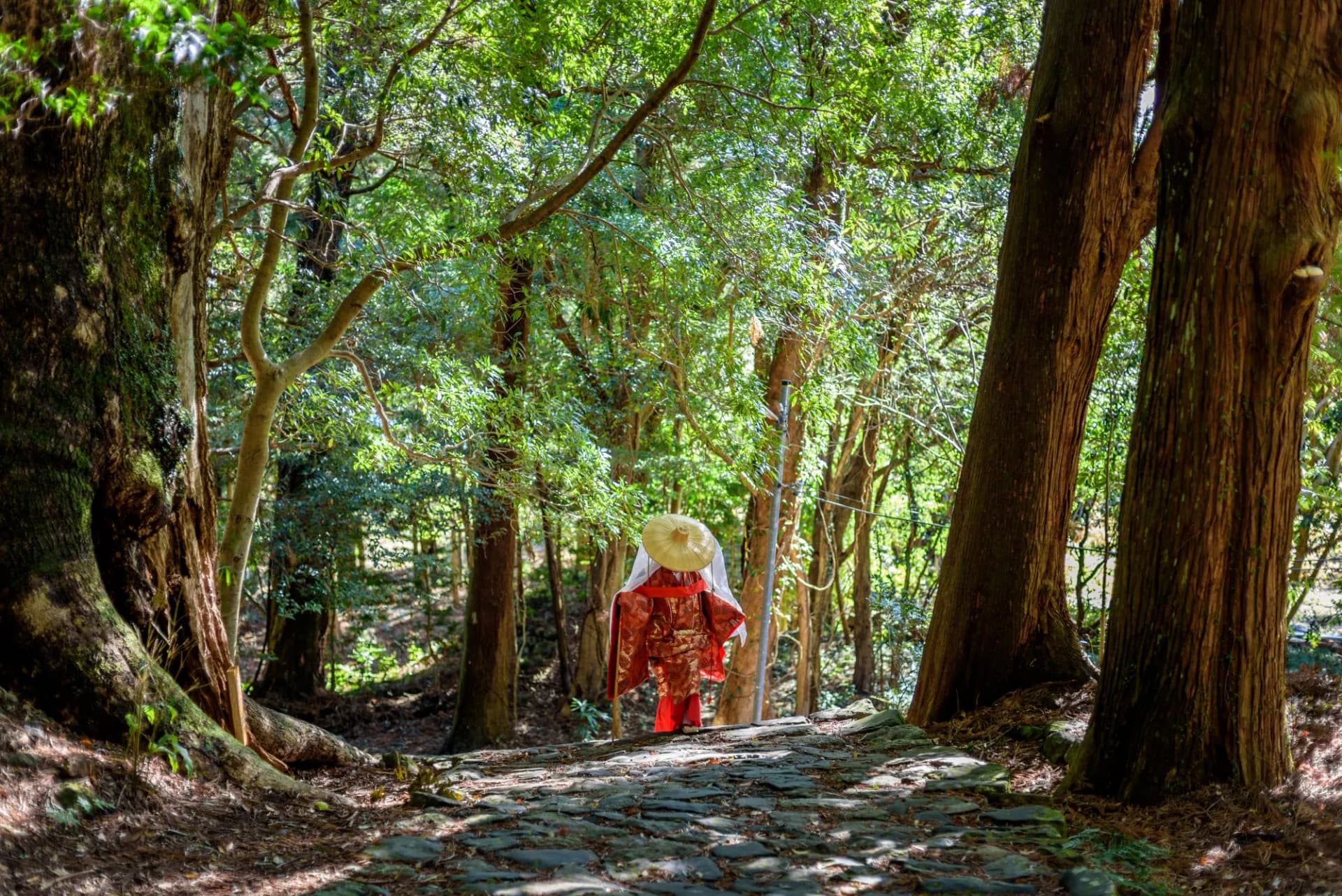 Japanese woman wearing traditional Heian Period costume at the Kumano Kodo Pilgrimage Route in Wakayama prefecture of Japan