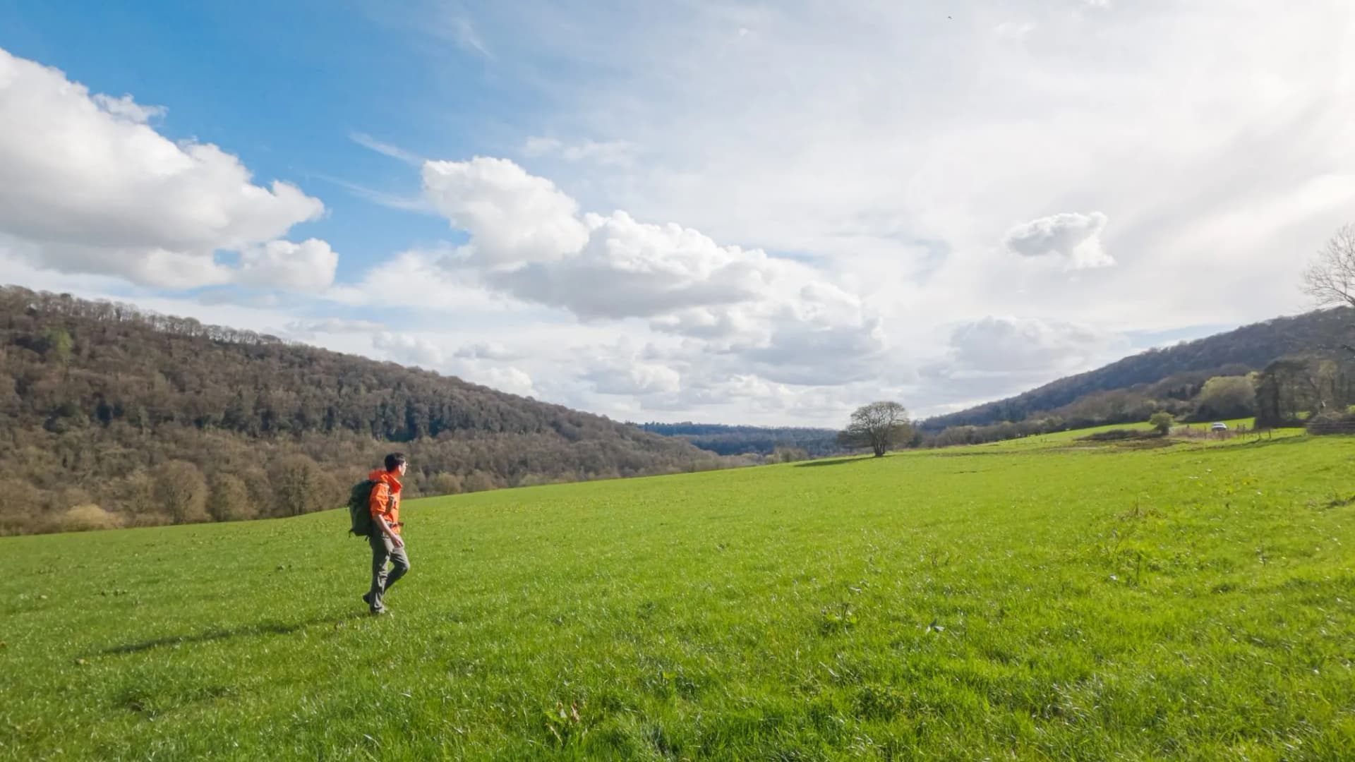 Backpacker Hiker walking in the forest and countryside of Chepstow, Monmouthshire, United Kingdom
