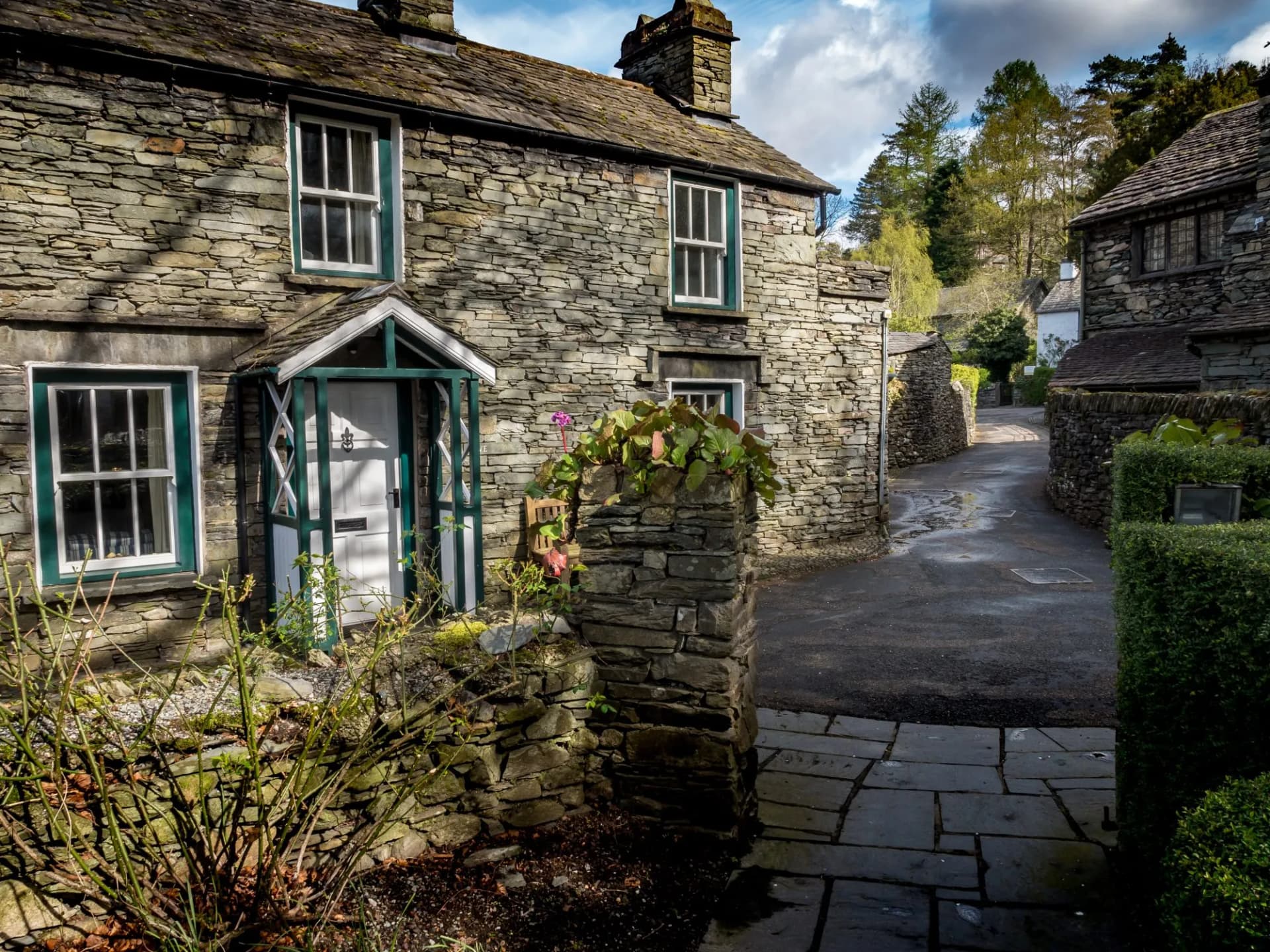 Grasmere, Cumbria, England. Traditional slate cottages in the English Lake District town of Grasmere known as the home of poet William Wordsworth.
