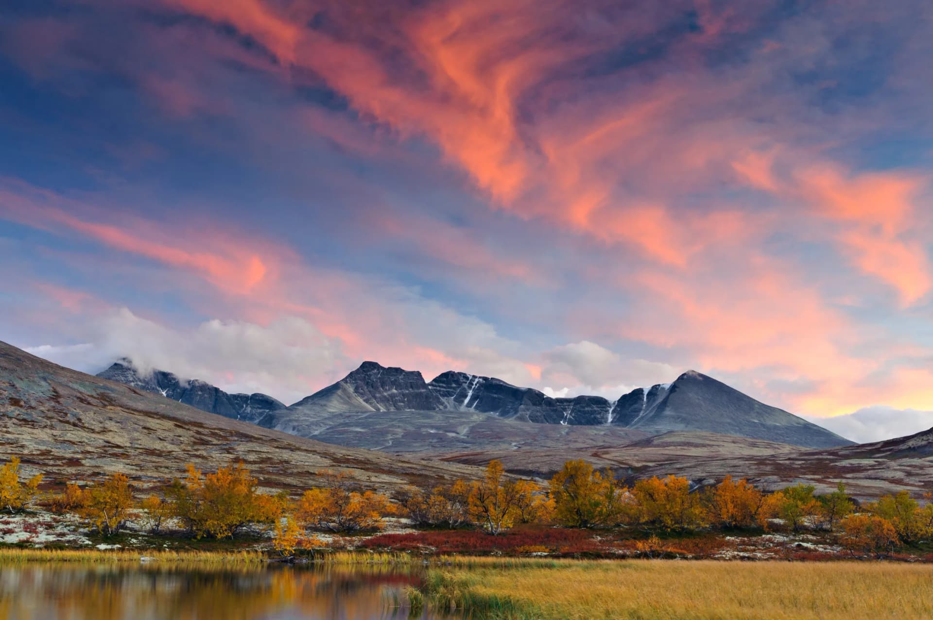 Sunset over Rondslottet mountain in Rondane National park, Norway, Europe
