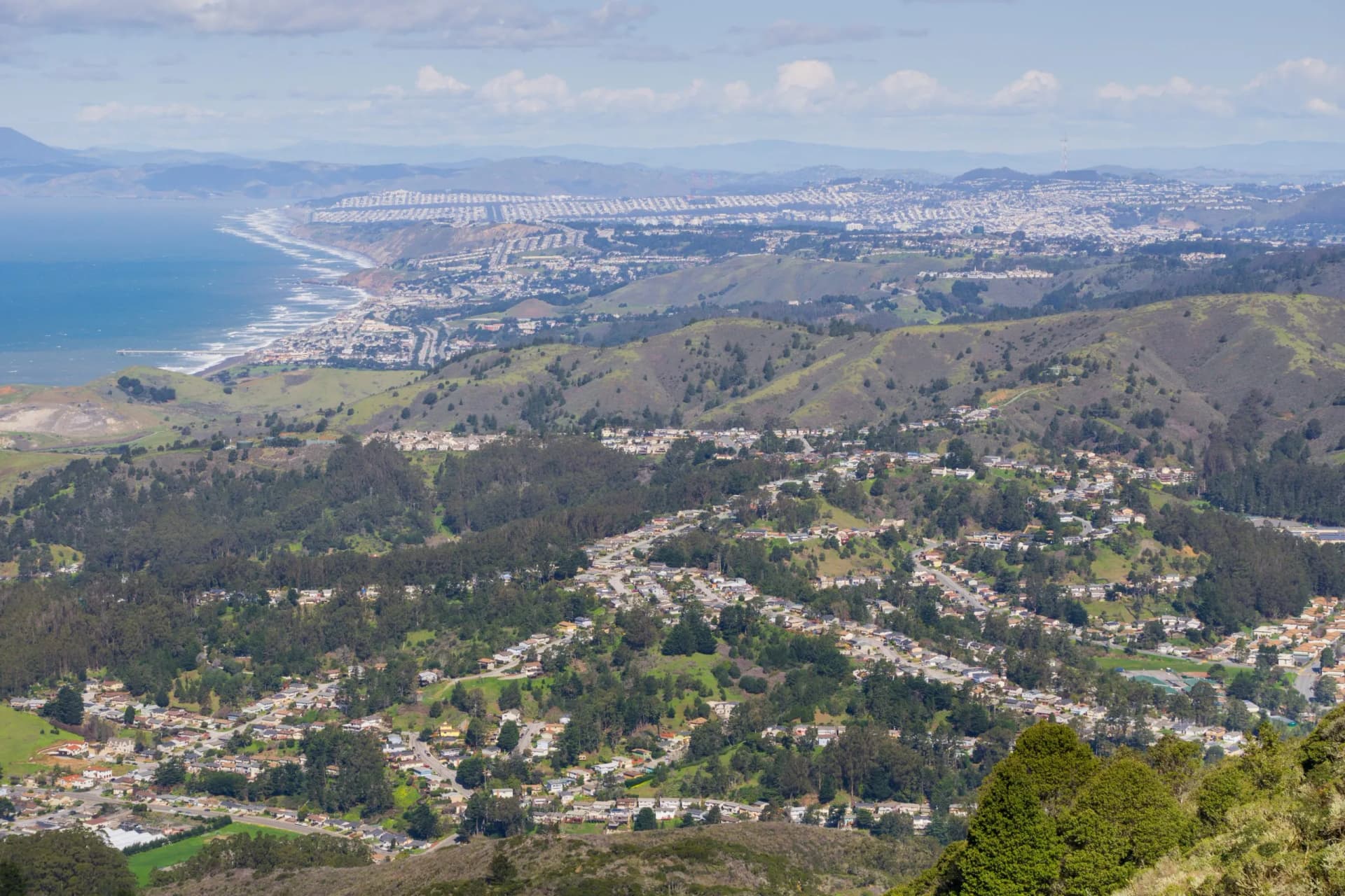 Aerial view of Pacifica and San Pedro Valley as seen from Montara mountain, San Francisco and Marin County in the background, California